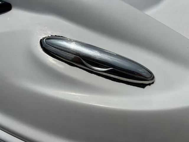 Slide: The Image of Close-up of a 2005 Crownline 216 LS boat cleat on a white surface. - 46