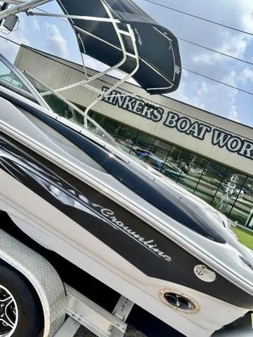 Slide: The Image of 2005 Crownline 216 LS boat at Tinker's Boat Works, featuring sleek design and trailer. - 8