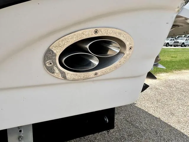 Slide: The Image of Exhaust pipes of a 2005 Crownline 216 LS boat, close-up view. - 9