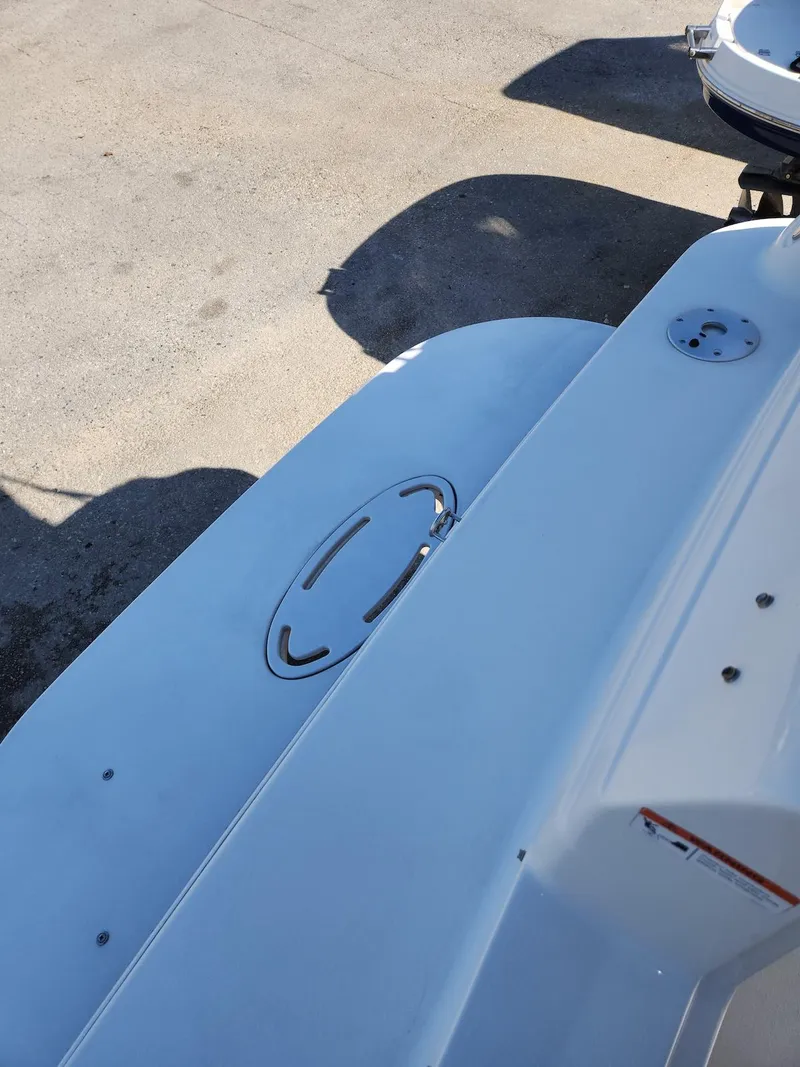 Slide: The Image of 2006 Larson Cabrio 260 boat deck with hatch and fittings. - 20