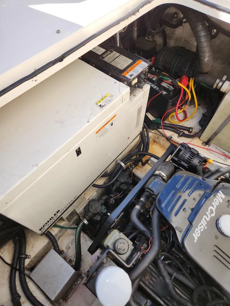 Slide: The Image of Engine compartment of a 2006 Larson Cabrio 260 boat, featuring a MerCruiser engine. - 31