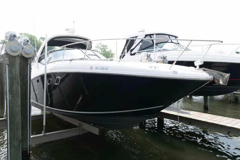 The Image of 2008 Sea Ray 330 Sundancer boat docked at marina, side view. - 0