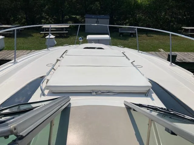 Slide: The Image of 2008 Sea Ray 330 Sundancer boat deck with sun pad and railing. - 12
