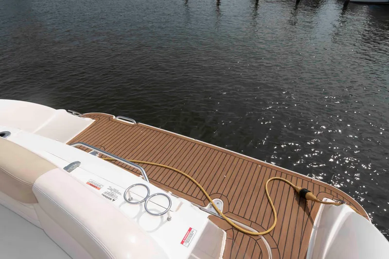 Slide: The Image of 2008 Sea Ray 330 Sundancer swim platform with teak decking and water hose. - 14