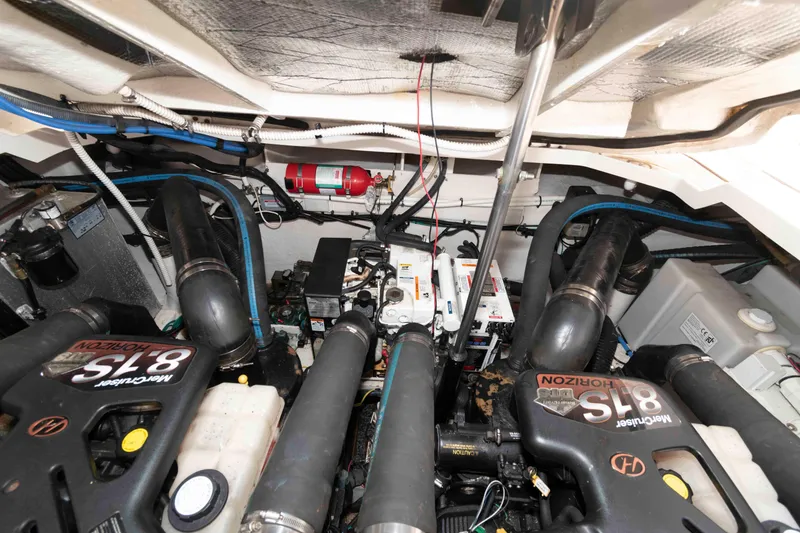 Slide: The Image of Engine room of 2008 Sea Ray 330 Sundancer with twin engines and fire extinguisher system. - 22