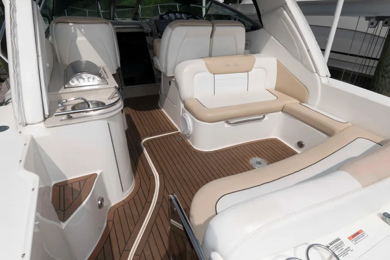 Slide: The Image of 2008 Sea Ray 330 Sundancer interior with elegant seating and teak flooring. - 3
