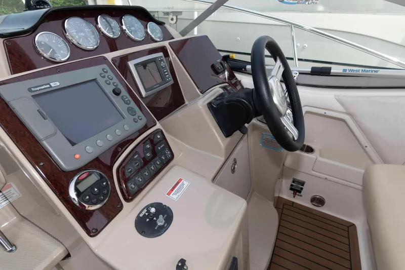Slide: The Image of Helm of 2008 Sea Ray 330 Sundancer with navigation instruments and steering wheel. - 7