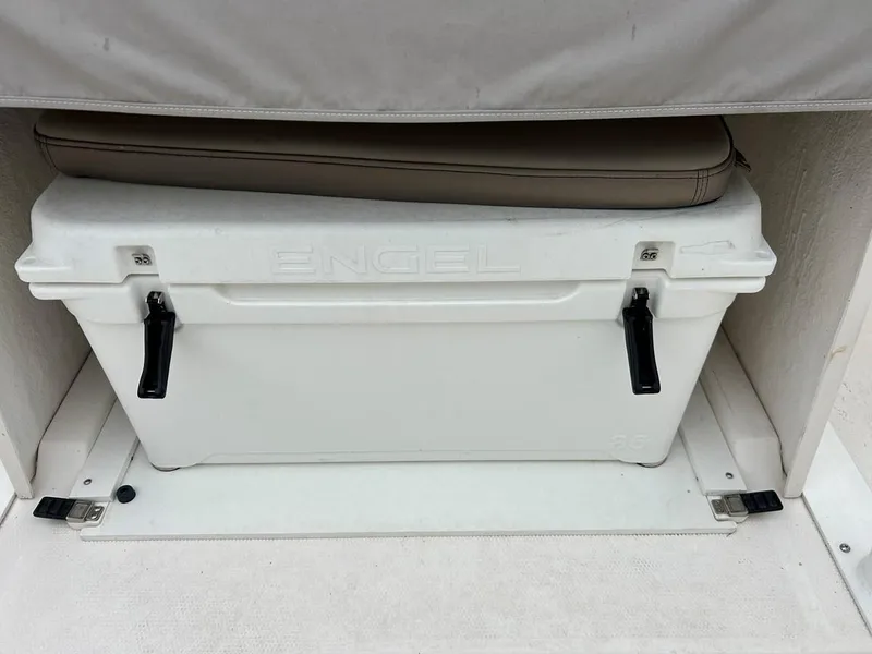 Slide: The Image of White Engel cooler with black handles on a 2021 Cutwater C-24 CW boat. - 8
