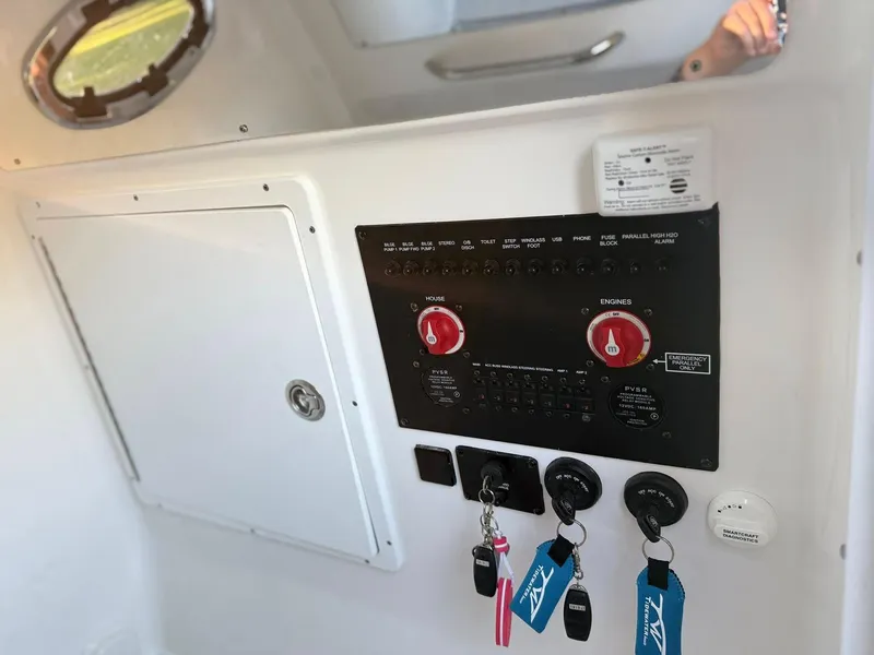 Slide: The Image of Control panel of 2025 Tidewater 3100 Carolina Bay boat with keys and switches. - 17