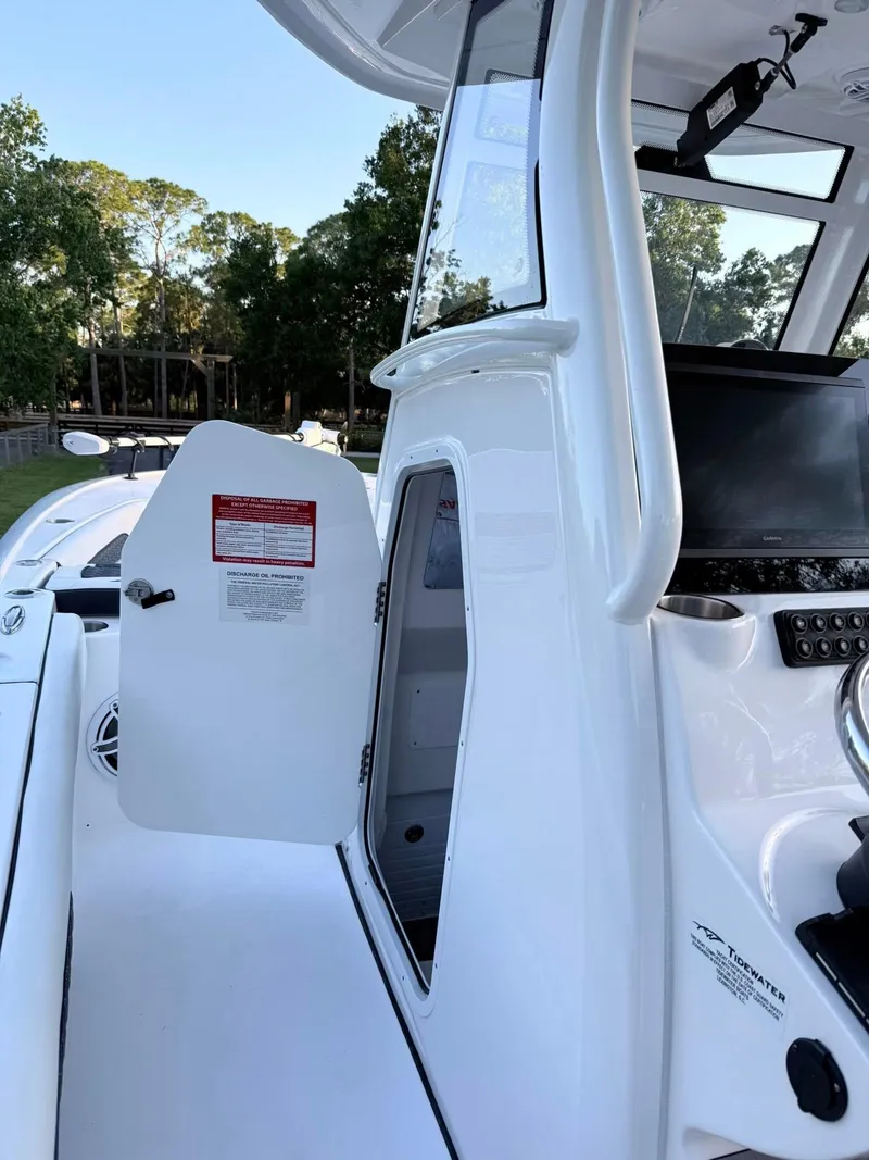 Slide: The Image of 2025 Tidewater 3100 Carolina Bay boat interior with open cabin door. - 21