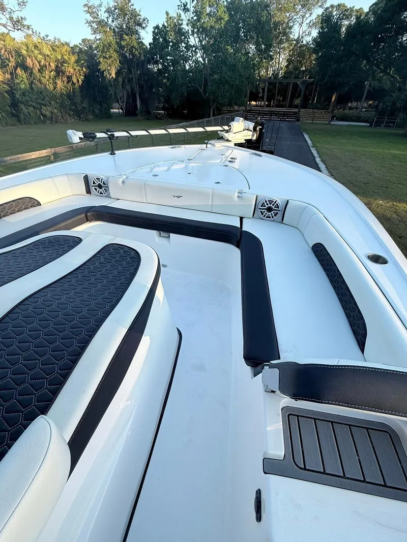 Slide: The Image of 2025 Tidewater 3100 Carolina Bay boat with sleek seating and modern design. - 31