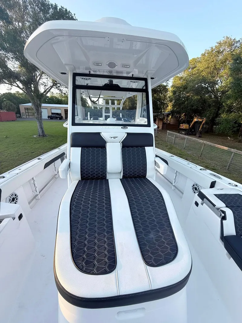 Slide: The Image of 2025 Tidewater 3100 Carolina Bay boat with sleek seating and modern design. - 34