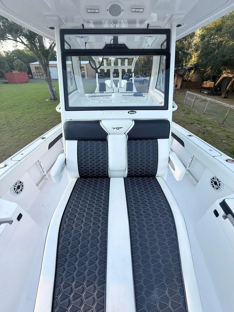 Slide: The Image of 2025 Tidewater 3100 Carolina Bay boat interior with sleek seating and modern design. - 39