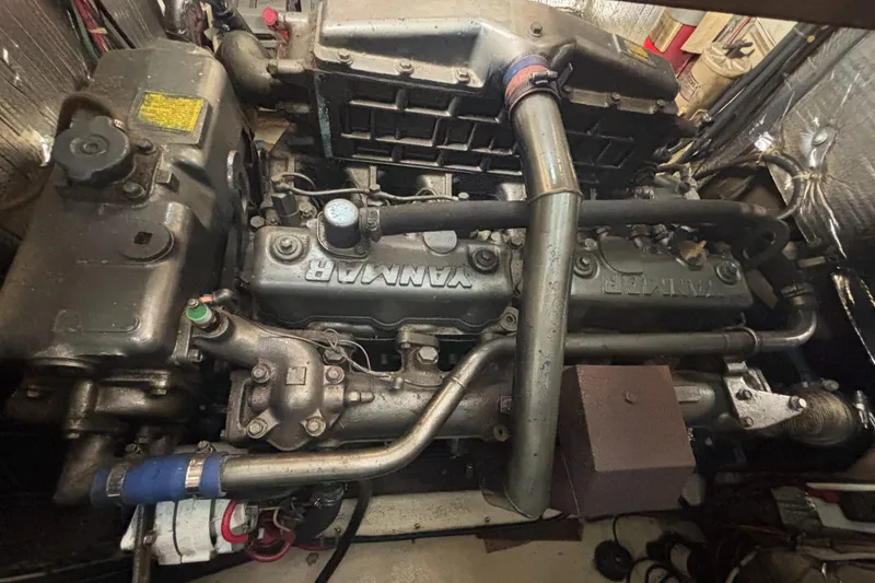 Slide: The Image of Engine of a 1985 Nordic Tug 32, showcasing detailed mechanical components. - 14