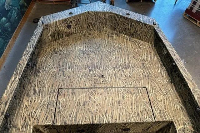 Slide: The Image of 2025 Tracker Grizzly 1650 T Prairie Wings Edition boat with camouflage interior design. - 3