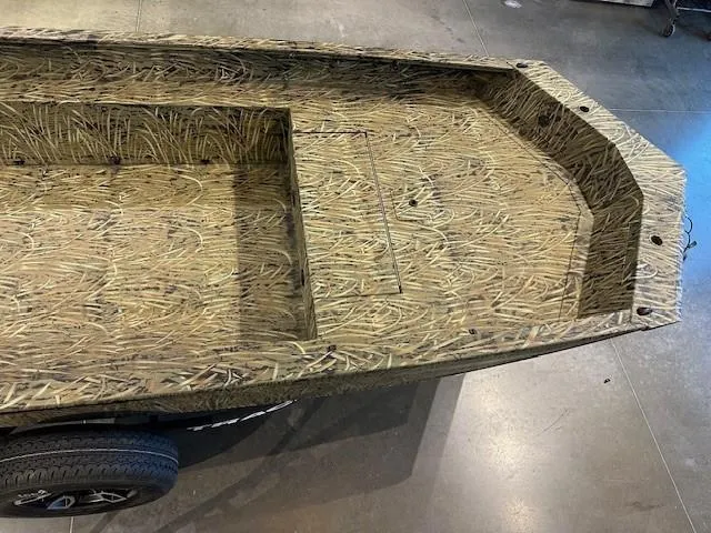 Slide: The Image of 2025 Tracker Grizzly 1650 T Prairie Wings Edition boat with camouflage design. - 4