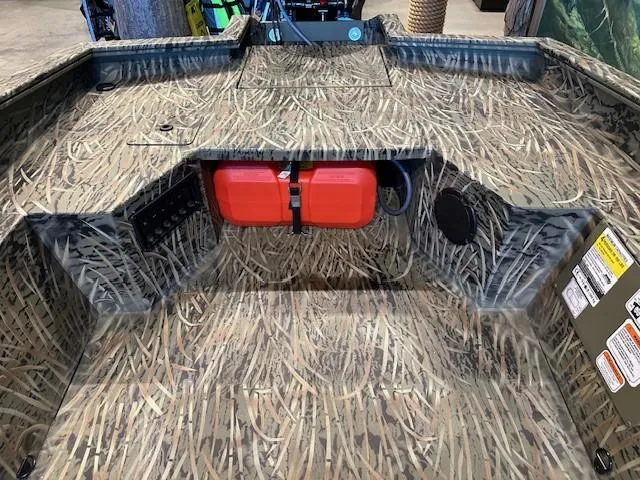 Slide: The Image of 2025 Tracker Grizzly 1650 T Prairie Wings Edition with camo interior and red storage compartment. - 8