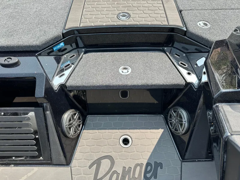 Slide: The Image of 2025 Ranger Z520R Cup-Equipped boat interior with storage compartments and speakers. - 11