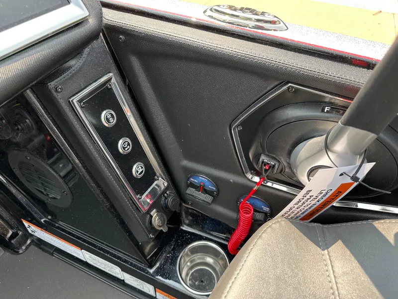 Slide: The Image of 2025 Ranger Z520R Cup-Equipped boat interior with control panel and speaker. - 13