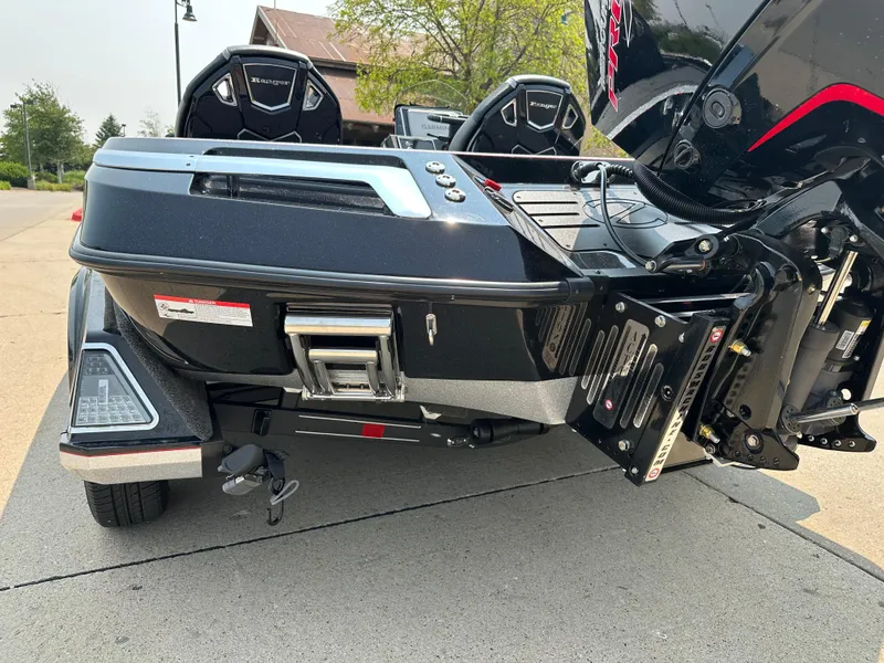 Slide: The Image of 2025 Ranger Z520R Cup-Equipped boat trailer, rear view, parked on pavement. - 5