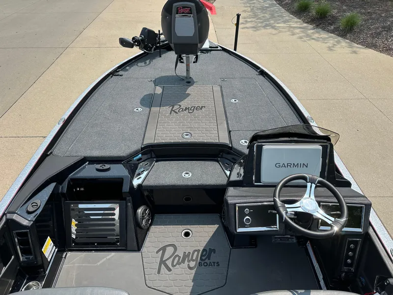 Slide: The Image of 2025 Ranger Z520R Cup-Equipped boat interior with Garmin system and steering wheel. - 9