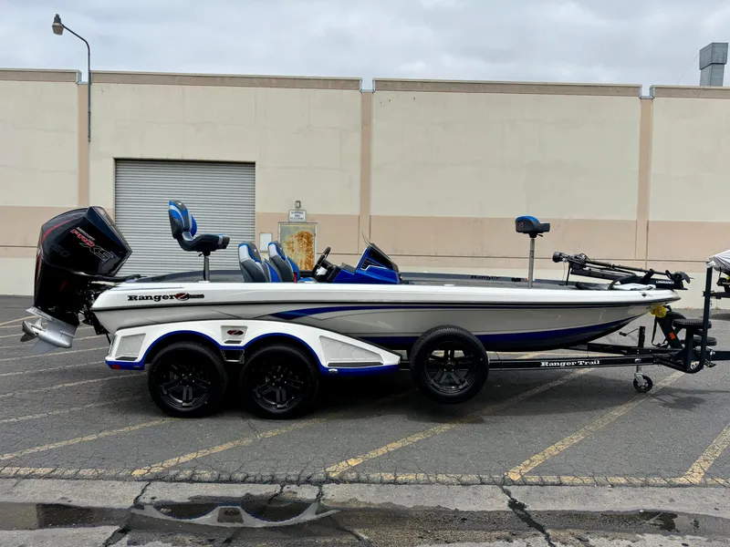 The Image of 2025 Ranger Z520R Cup-Equipped boat on trailer, parked outdoors. - 1