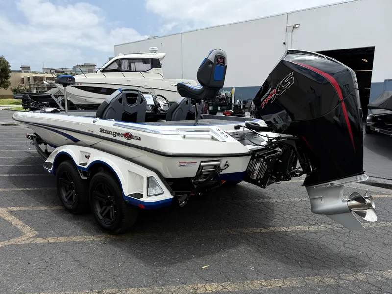 Slide: The Image of 2025 Ranger Z520R Cup-Equipped boat with powerful engine, parked outdoors. - 4