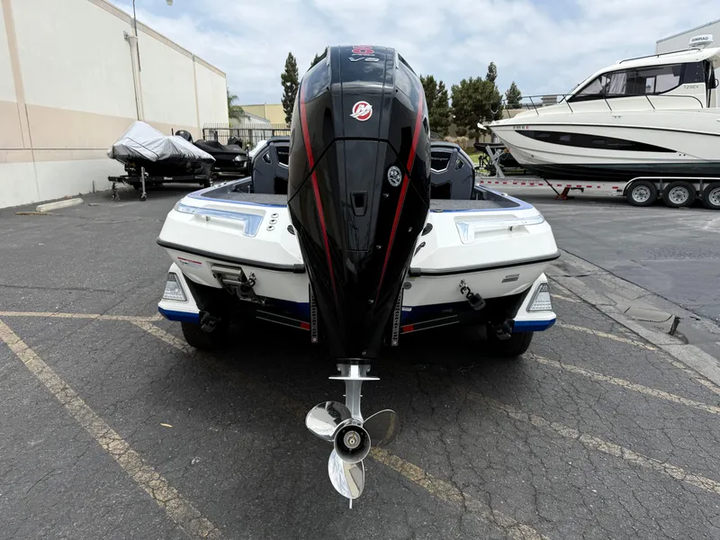 Slide: The Image of 2025 Ranger Z520R Cup-Equipped boat, rear view, parked in a marina lot. - 6