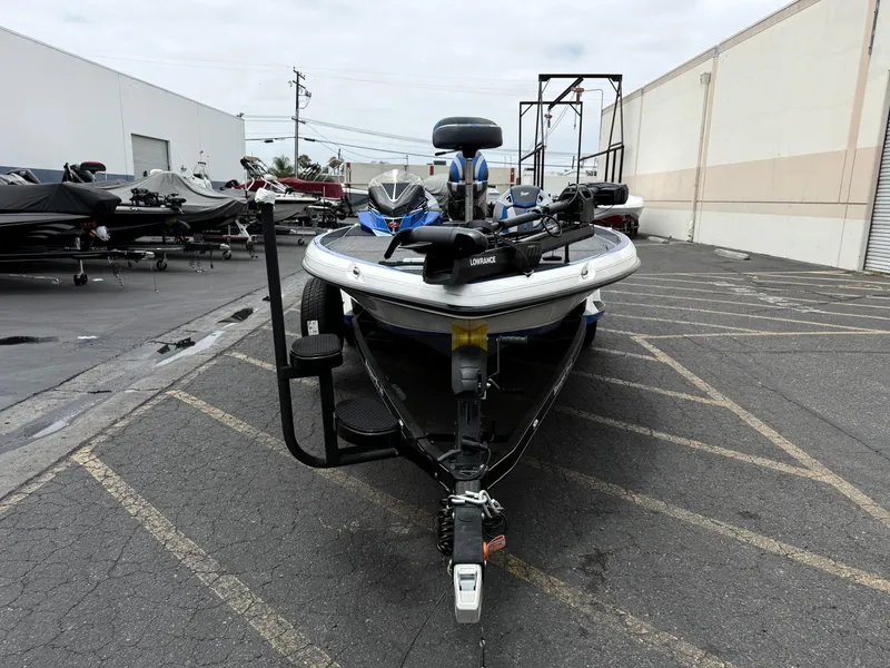 Slide: The Image of 2025 Ranger Z520R Cup-Equipped boat in parking lot, front view, with trailer attachment. - 7