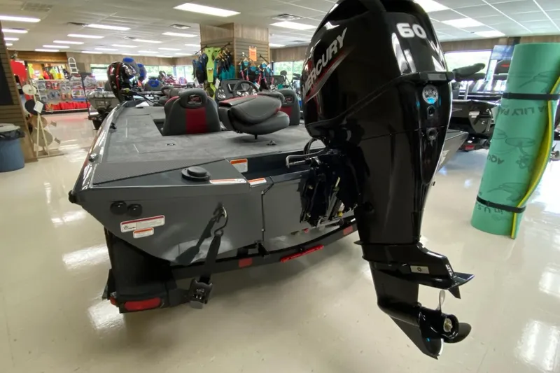 Slide: The Image of 2025 Ranger RT178C boat with Mercury 60 engine displayed in showroom. - 3