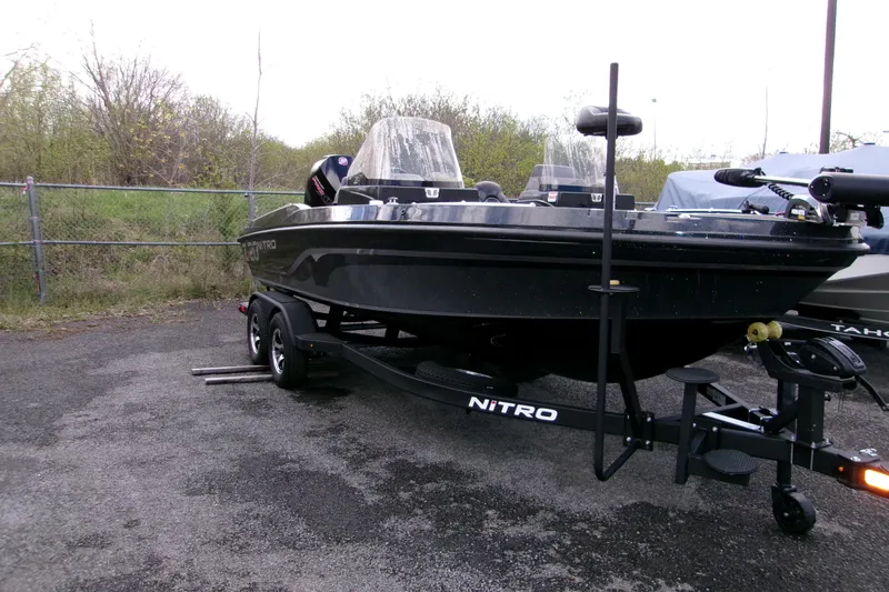 The Image of 2025 Nitro ZV20 boat on trailer, parked outdoors, showcasing sleek design and modern features. - 0