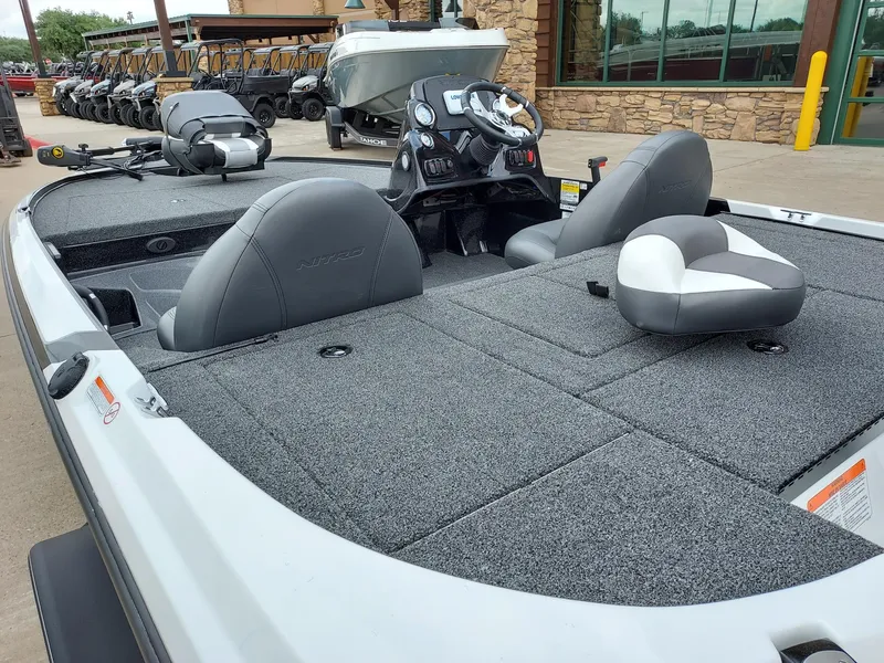 Slide: The Image of 2025 Nitro Z17 boat with gray seating and dashboard, displayed outdoors. - 3