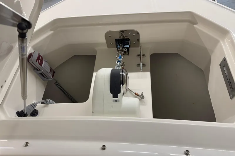 Slide: The Image of Anchor compartment of 2026 Sailfish 316 DC boat, featuring modern equipment and storage space. - 18