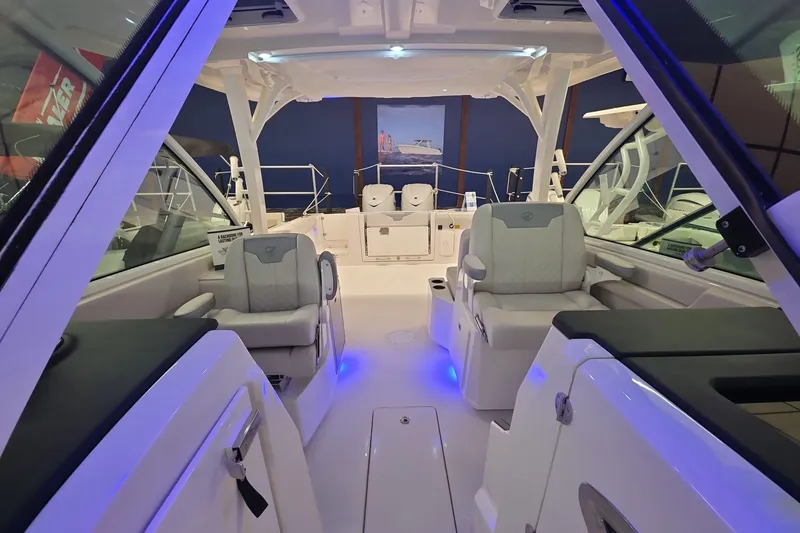 Slide: The Image of 2026 Sailfish 316 DC boat interior with modern seating and ambient lighting. - 33