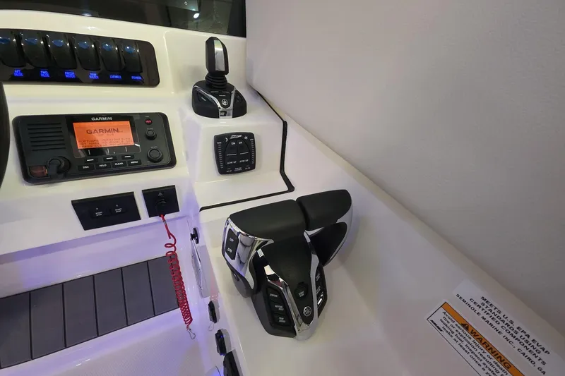 Slide: The Image of Control panel of 2026 Sailfish 316 DC boat with Garmin navigation system. - 36