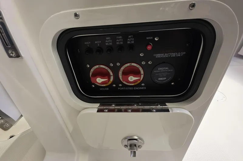 Slide: The Image of Control panel of 2026 Sailfish 316 DC boat with switches and battery controls. - 41