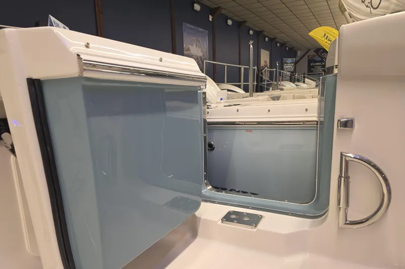 Slide: The Image of 2026 Sailfish 316 DC boat interior with open door, showcasing sleek design and modern features. - 42