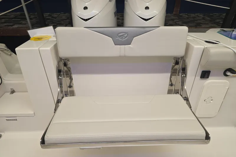 Slide: The Image of 2026 Sailfish 316 DC boat seat with sleek white upholstery and stainless steel frame. - 46