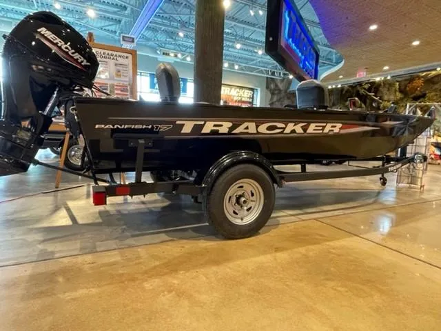 The Image of 2025 Tracker Panfish 17 boat displayed indoors with Mercury engine. - 0