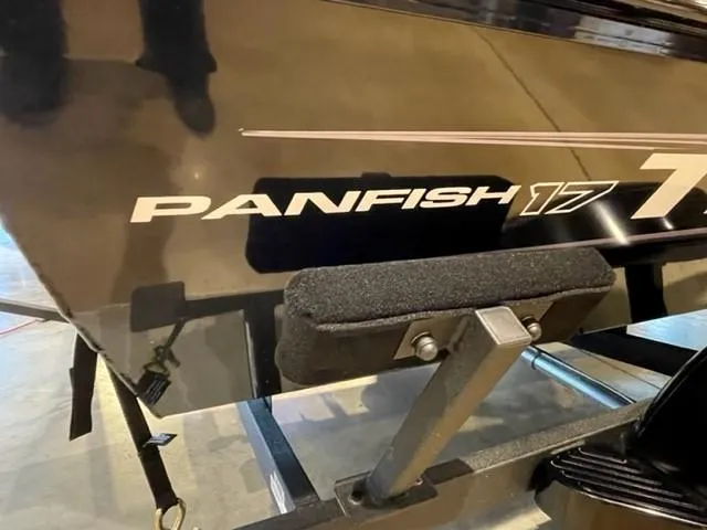 Slide: The Image of 2025 Tracker Panfish 17 boat detail, showcasing model name on black hull. - 2