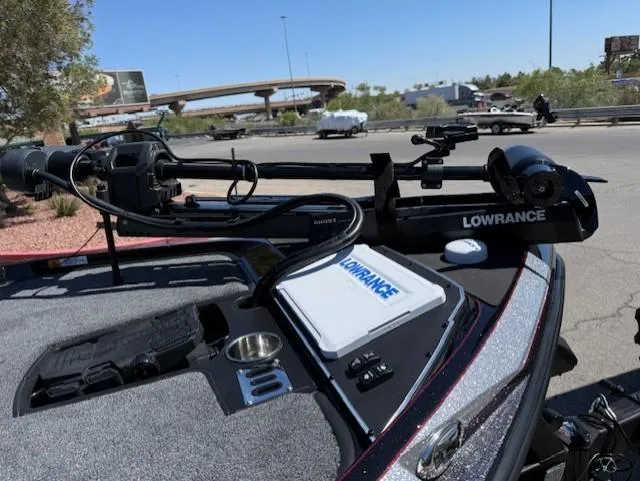Slide: The Image of 2025 Ranger Z519R Cup-Equipped boat with Lowrance equipment, parked outdoors. - 10