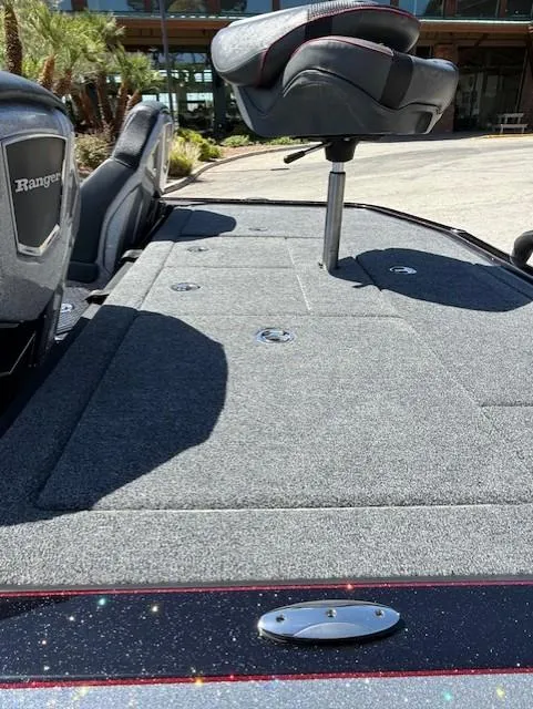 Slide: The Image of 2025 Ranger Z519R Cup-Equipped boat with elevated seat and carpeted deck. - 11