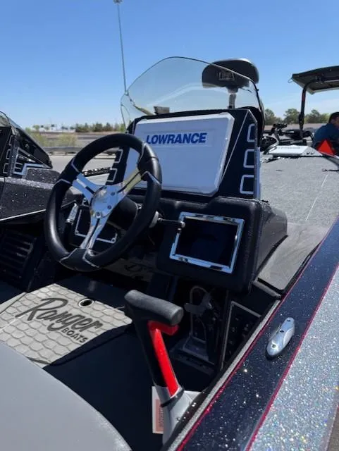 Slide: The Image of 2025 Ranger Z519R Cup-Equipped boat dashboard with Lowrance electronics and steering wheel. - 7
