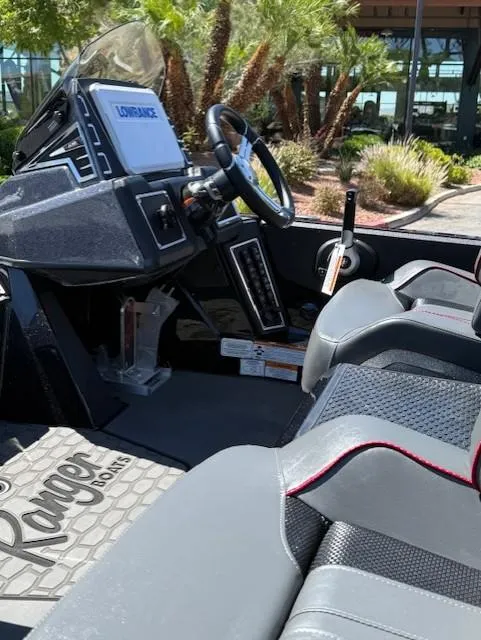 Slide: The Image of 2025 Ranger Z519R Cup-Equipped boat interior with advanced controls and seating. - 8
