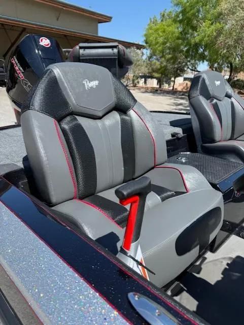 Slide: The Image of 2025 Ranger Z519R Cup-Equipped boat seats with sleek design and red accents. - 9