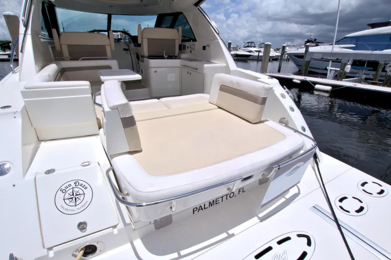 Slide: The Image of 2013 Sea Ray 450 Sundancer yacht with spacious seating at a marina in Palmetto, Florida. - 12