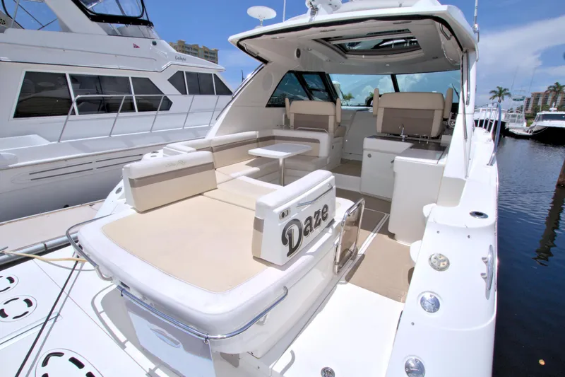 Slide: The Image of 2013 Sea Ray 450 Sundancer yacht with spacious deck and seating area. - 13