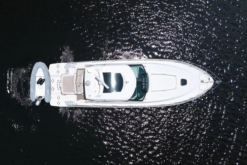 Slide: The Image of Overhead view of 2013 Sea Ray 450 Sundancer yacht on sparkling water. - 2