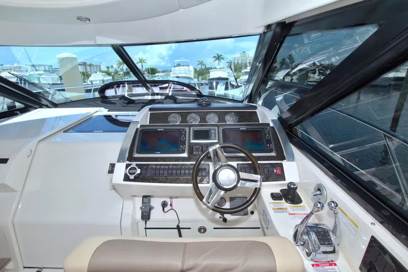 Slide: The Image of Cockpit of 2013 Sea Ray 450 Sundancer yacht with modern navigation equipment. - 25