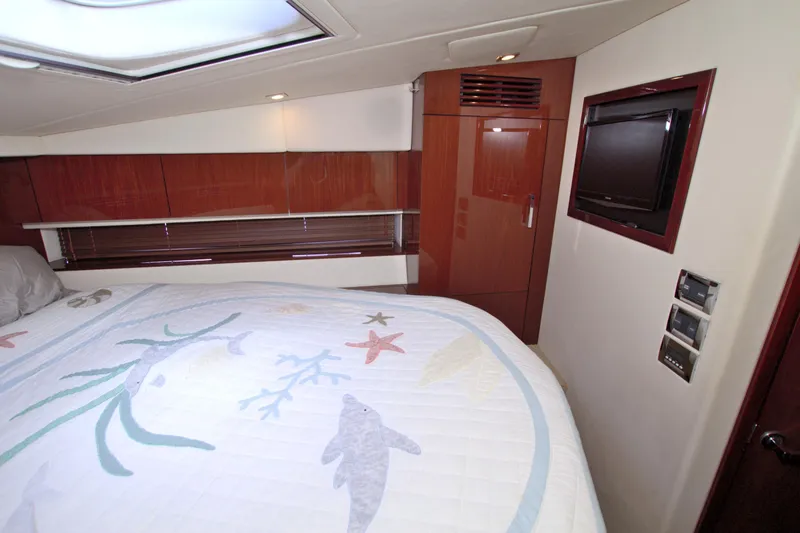 Slide: The Image of Luxurious cabin interior of 2013 Sea Ray 450 Sundancer yacht with elegant wood finishes. - 36
